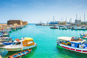 Boats moored in Heraklion old venetian port harbour in Crete.
