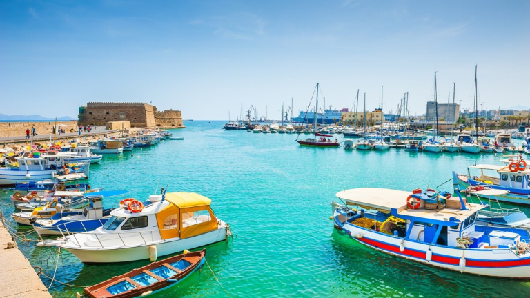 Boats moored in Heraklion old venetian port harbour in Crete.