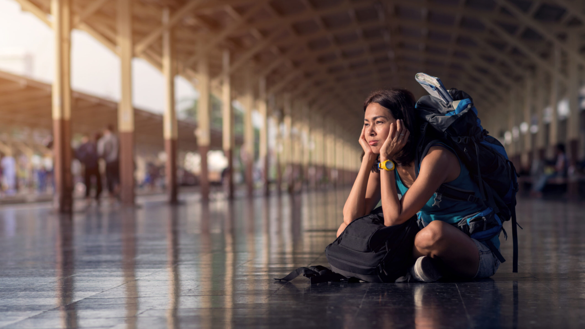Asia,Woman,With,Bag,Backpack,And,Sitting,Bored,Wait,A